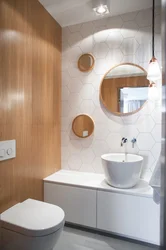 Tiles in the bathroom and toilet in the same style photo