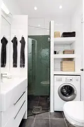 Bathroom design with shower and toilet made of tiles and washing machine