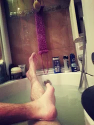 Photo of men in foam in bathtub
