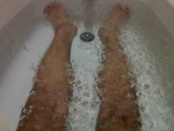 Photo of men in foam in bathtub