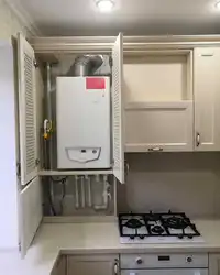 Interior of a small kitchen with a boiler