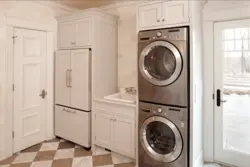 Washer And Dryer In A Column In The Bathroom Interior