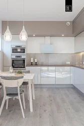 White kitchen with gray floor in the interior