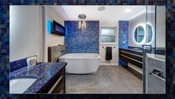 Photo of a bathtub with a blue floor