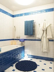 Photo of a bathtub with a blue floor