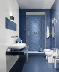 Photo of a bathtub with a blue floor