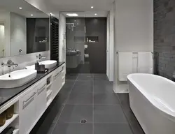 Bathroom design with gray tiles on the floor