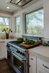 Gas Stove By The Window In The Kitchen Interior