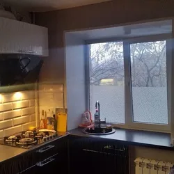 Gas Stove By The Window In The Kitchen Interior