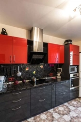 Photo of a kitchen with a black panel