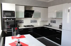 Photo Of A Kitchen With A Black Panel