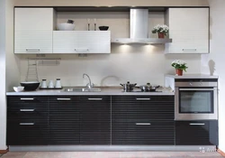 Photo of a kitchen with a black panel