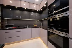 Photo of a kitchen with a black panel