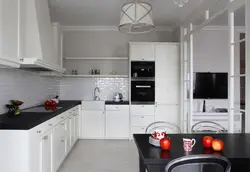 Kitchen with black handles in a white interior