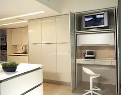 TV above the refrigerator in the kitchen photo
