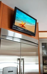 TV Above The Refrigerator In The Kitchen Photo