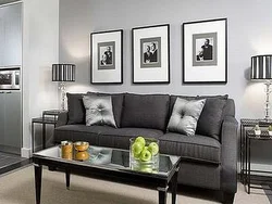 Furniture in the living room interior with gray wallpaper