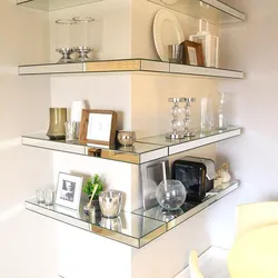 Glass shelves on the wall in the living room interior