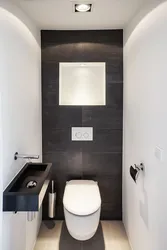 Toilet With Washbasin In The Apartment Photo