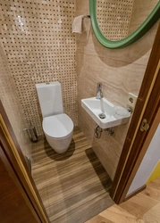 Toilet with washbasin in the apartment photo