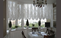 French curtains in the kitchen interior