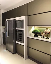 Free-Standing Refrigerator In The Interior Of The Kitchen Living Room