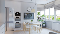 Free-standing refrigerator in the interior of the kitchen living room