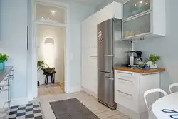 Free-standing refrigerator in the interior of the kitchen living room