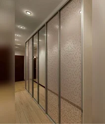 Photo of a hallway with a wardrobe in a modern style, narrow and long