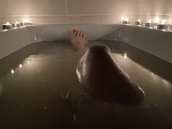 Photo Of A Bathtub With Foam And Legs