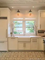 Photo of a kitchen on one wall with a window