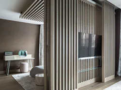Slatted partition in the interior of the living room photo
