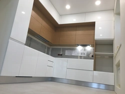 Kitchen with high upper cabinets photo