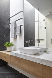Bathroom design in gray tone with wood