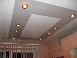 Bathroom ceiling made of plastic panels with spotlights photo