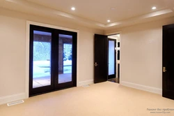 Dark Doors, Light Floor In The Interior Of The Apartment