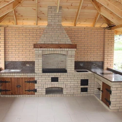 Summer kitchen design with barbecue area