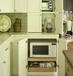 Kitchen interior with built-in microwave