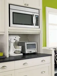 Kitchen interior with built-in microwave