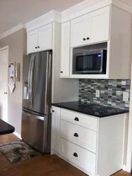 Kitchen interior with built-in microwave