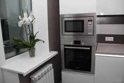 Kitchen interior with built-in microwave