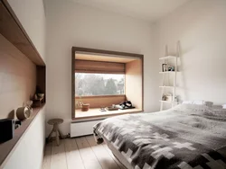 Интерьер спальной комнаты с окном