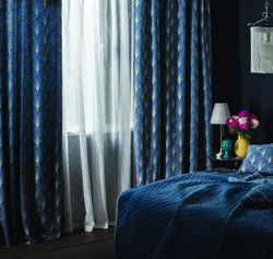 Blue curtains in the bedroom interior