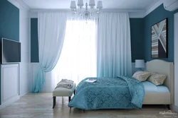 Blue curtains in the bedroom interior