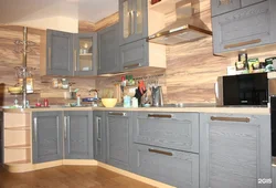 Gray kitchen with wooden facades photo