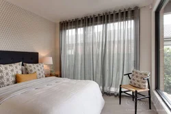 Modern curtains in the bedroom interior photo