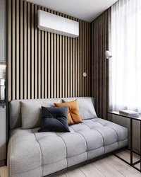 Slats in the living room interior on the wall behind the sofa