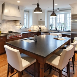 Kitchen design with a large table photo