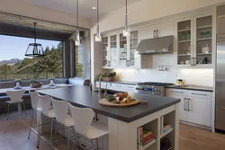 Kitchen design with a large table photo