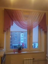 Tulle curtains for the kitchen up to the windowsill photo